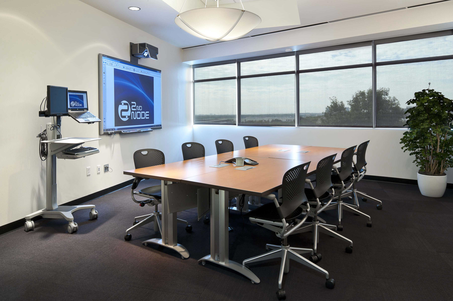 small multi-purpose conference room with a meeting table
