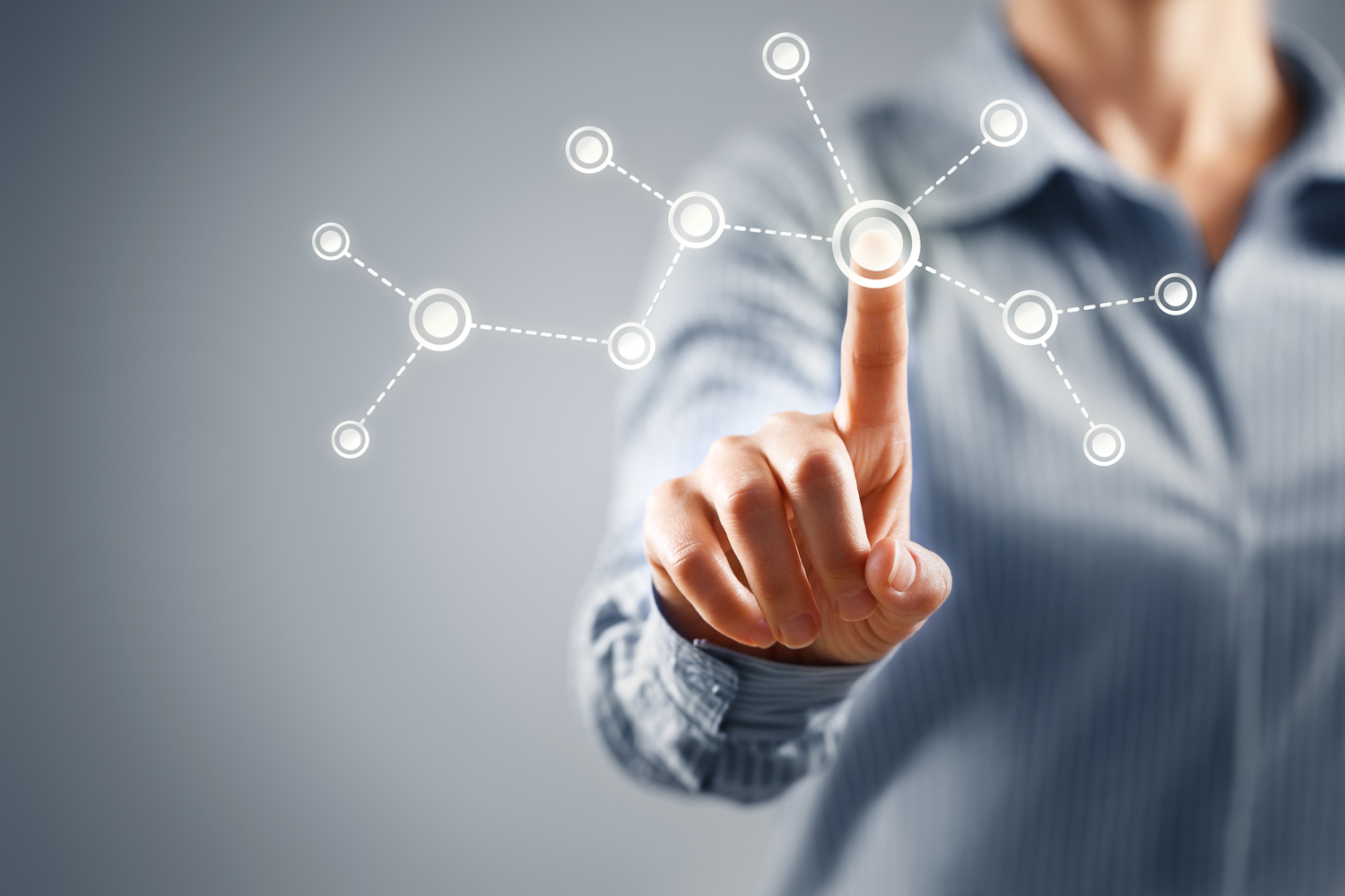 businesswoman pointing at a data graphic overlay